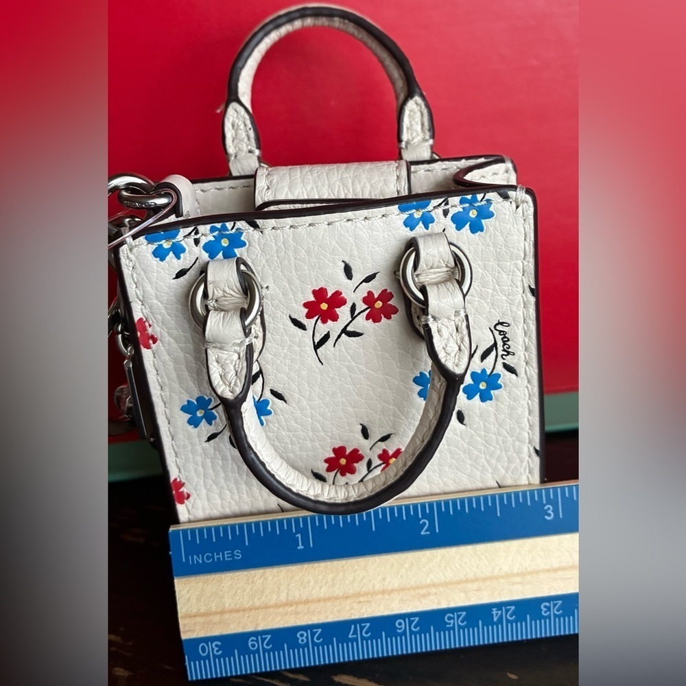 Coach Floral Key Holder in White with Red and Blue Accents - Picture 3 of 13